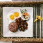plate of foods on brown wicker tray